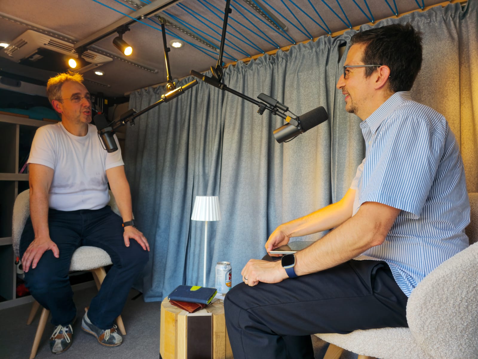Two people recording podcast in studio